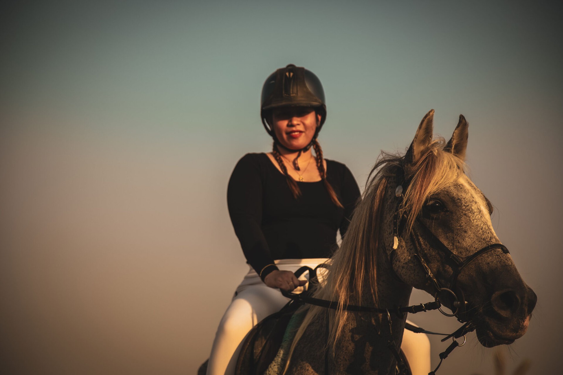 Rider on horseback at golden hour
