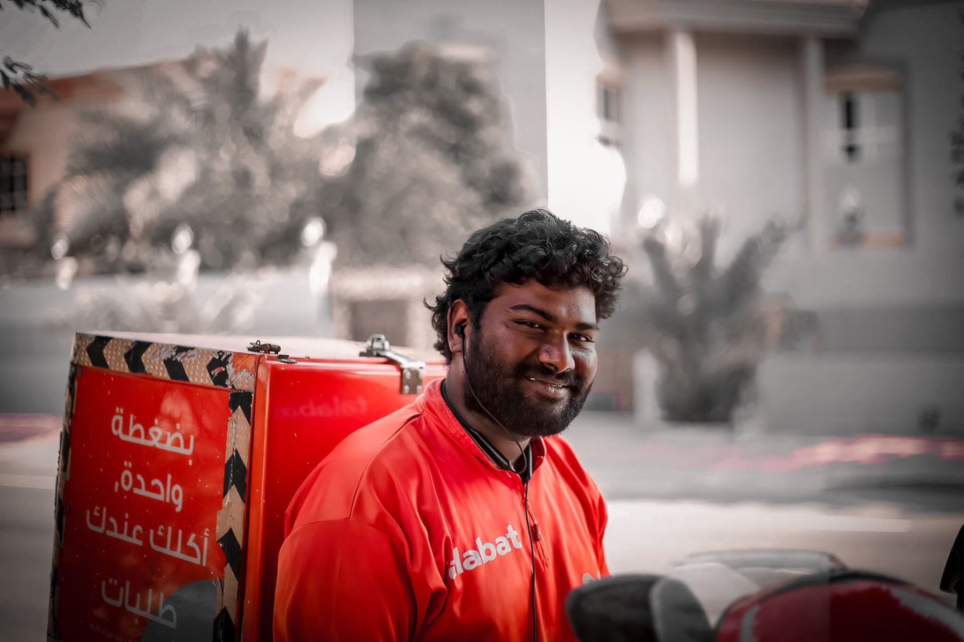 Talabat delivery rider street portrait