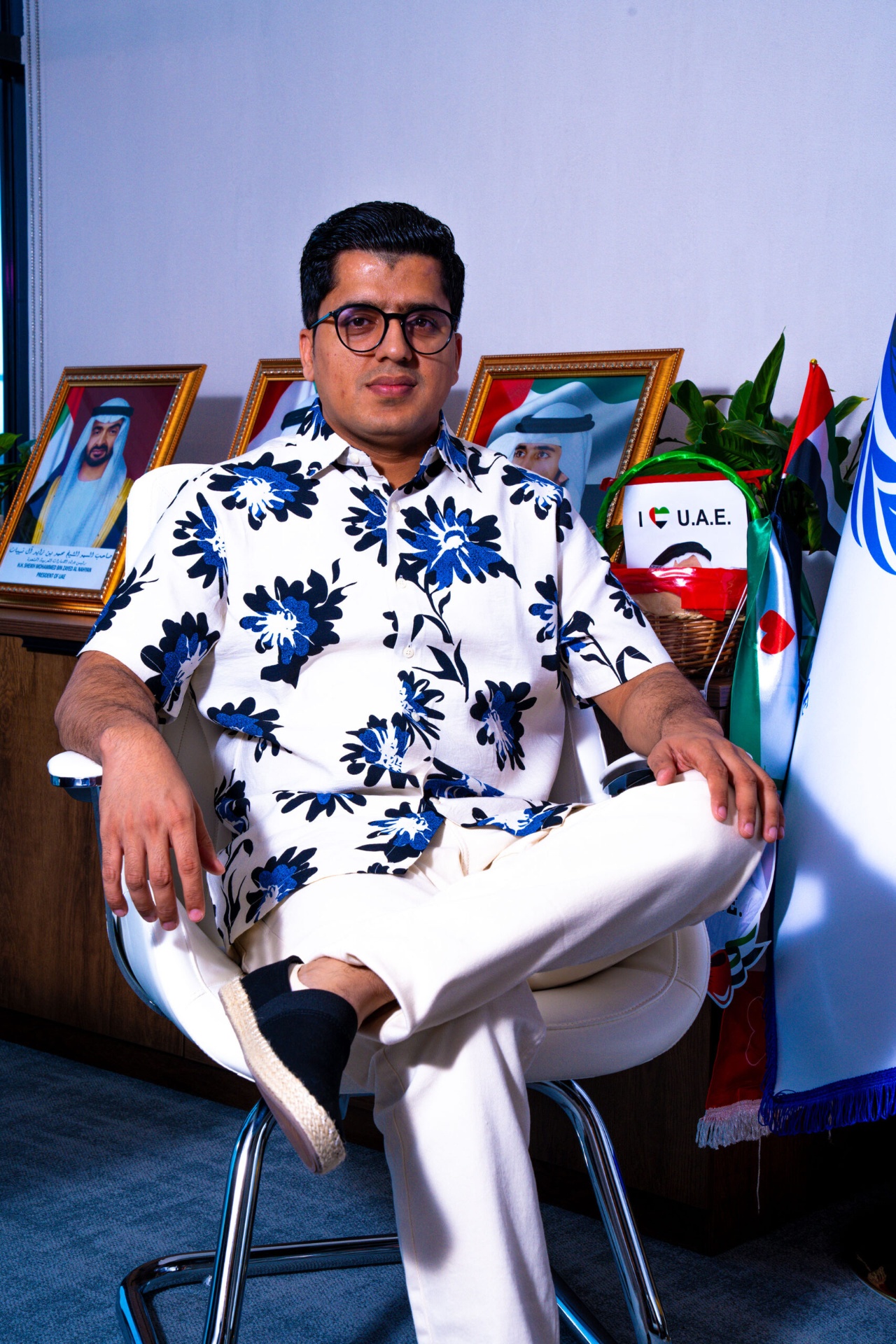 Seated portrait in floral shirt at office