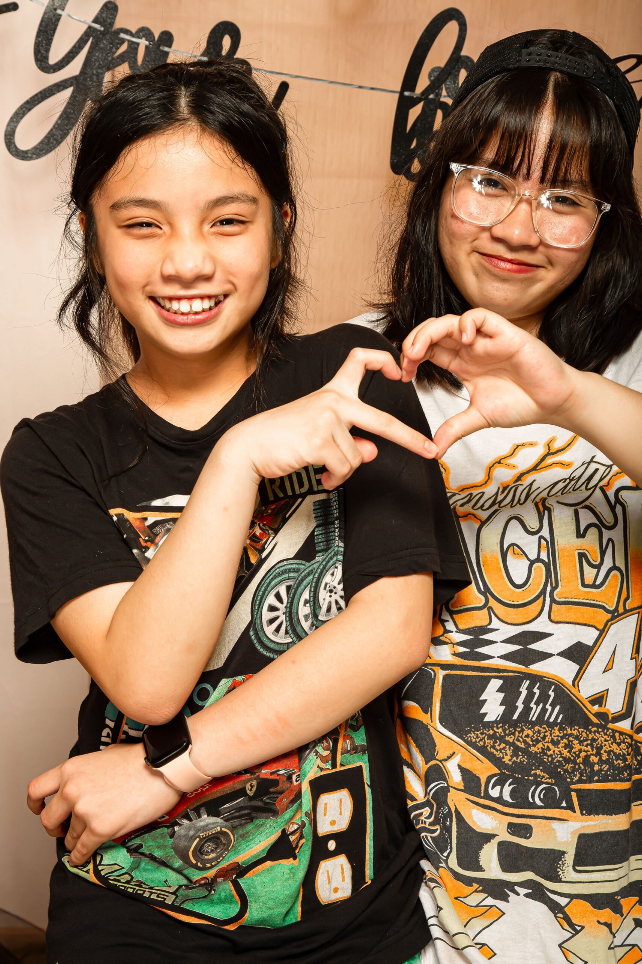 Friends portrait with heart hands